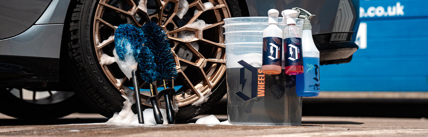 Two detailing buckets with grit guards set up for a two bucket wash