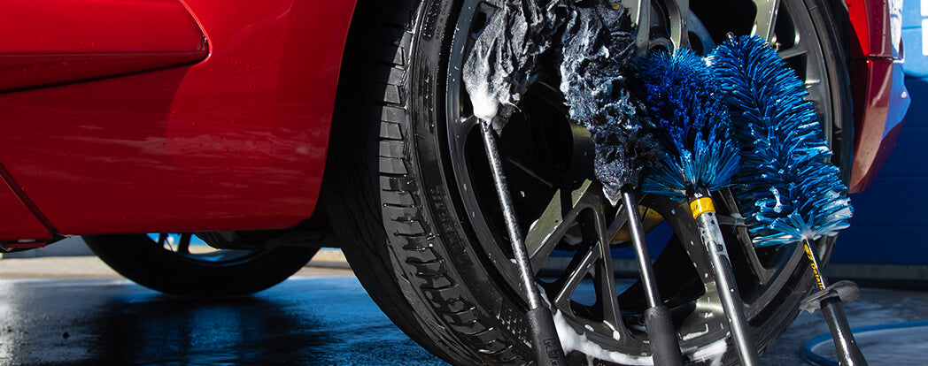 What kind of brushes should you use when washing a car?