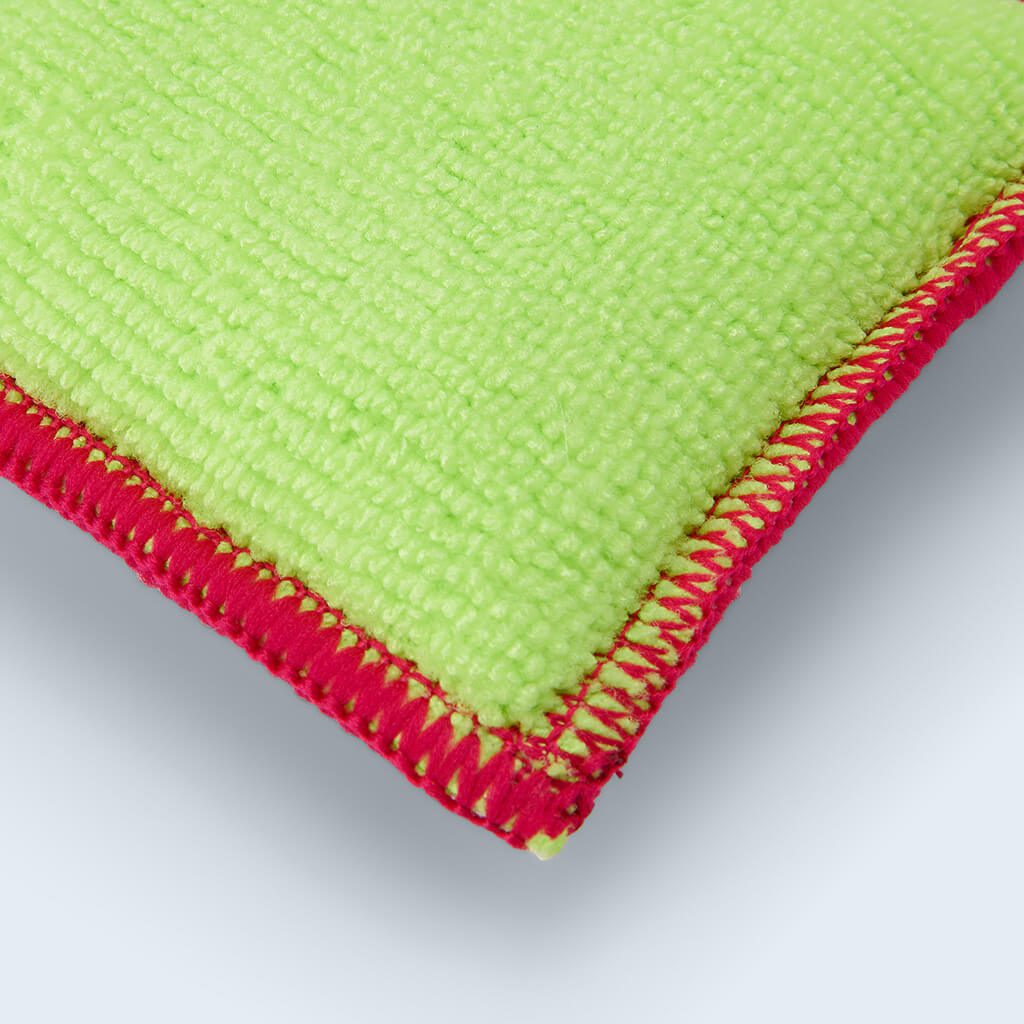 Duel scrub pad top side showing red stitching close up