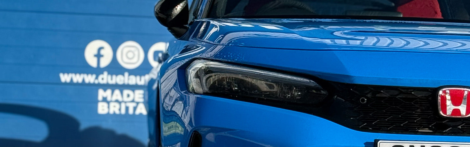 Freshly washed car with water beading on the bonnet