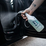 Logic interior app being sprayed with a Duel professional dilution bottle