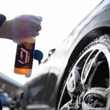 Duel cleanse tyre cleaner being sprayed onto a tyre